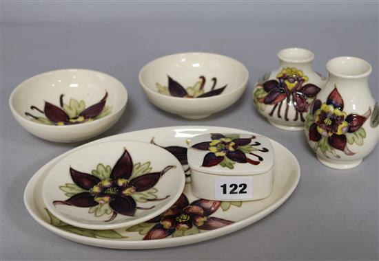 A group of Moorcroft Aquilegia dishes, together with two vases and a box (7)